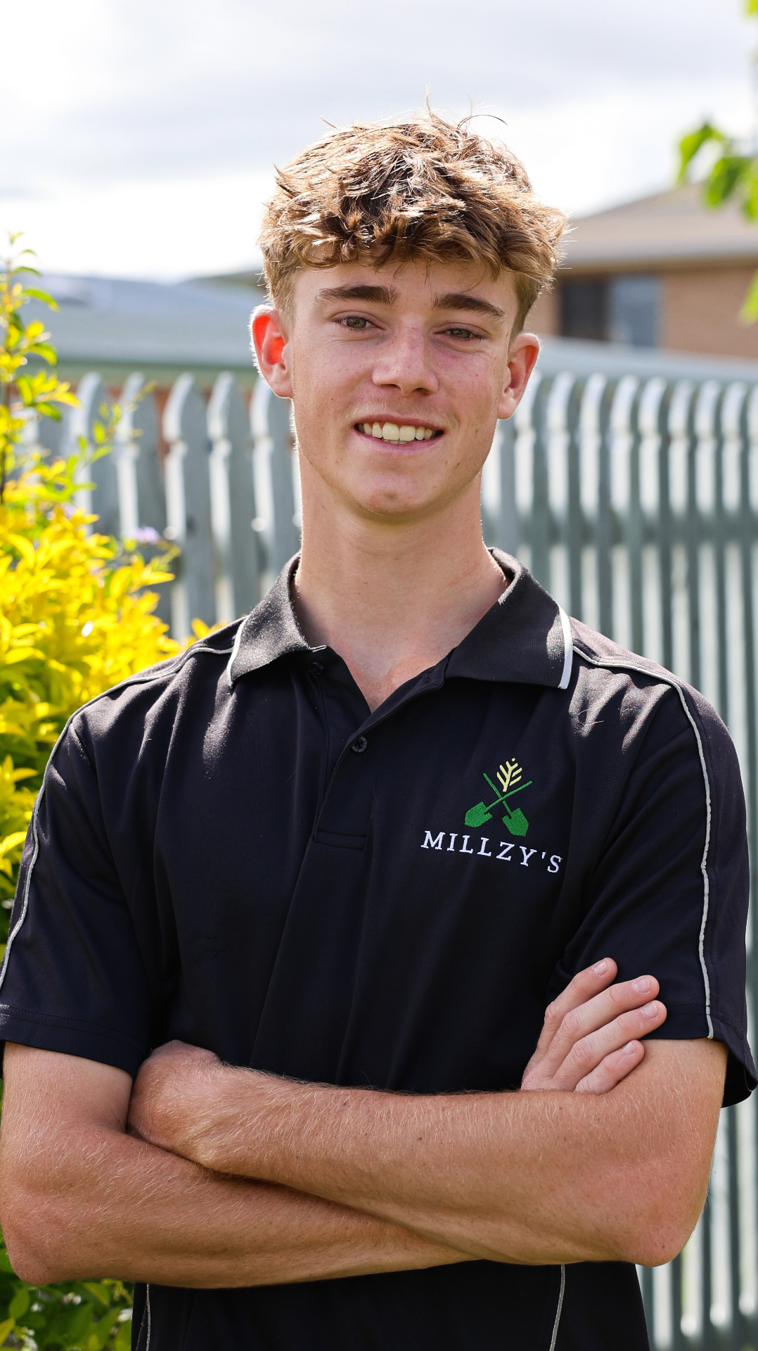 Connor Mills, Millzy's car detailing specialist in Rockhampton, standing in the detailing workshop