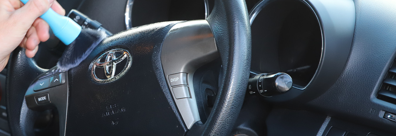 Car detailing Rockhampton - interior cleaning showing dashboard, leather seats, and trim restoration